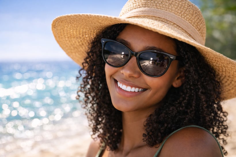 person with wearing shades at the beach